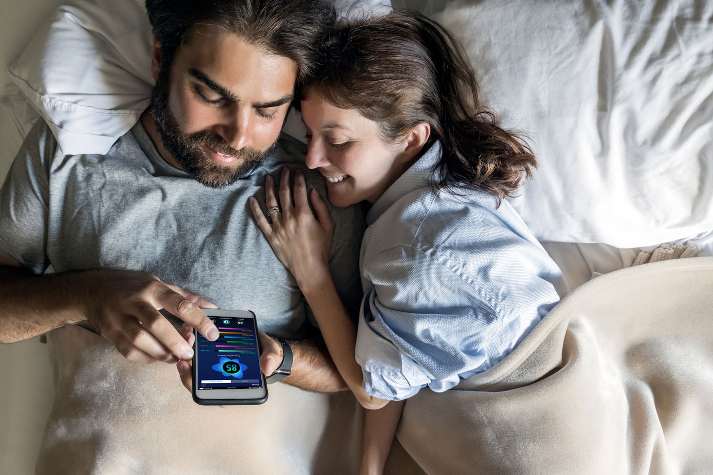 couple-in-bed-with-phone-3