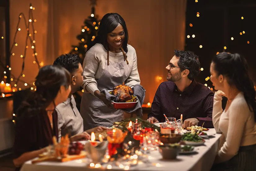 Group eating a holiday meal at the table