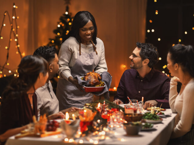 Group eating a holiday meal at the table